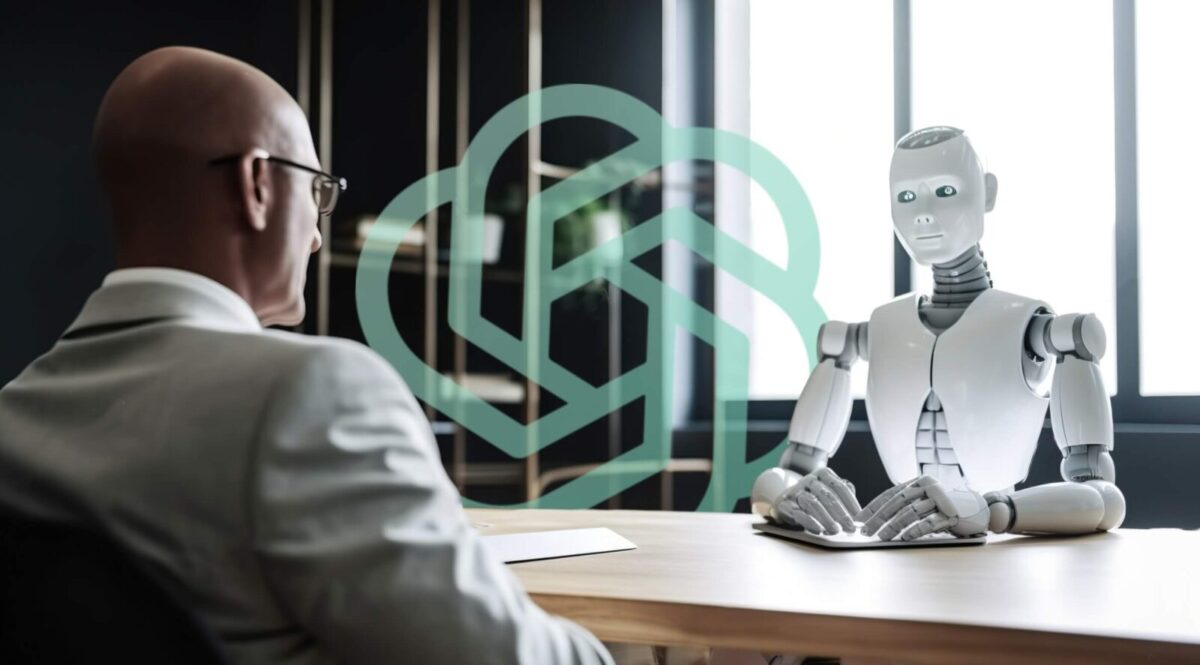 Zdjęcie jest ilustracją do artykułu: ChatGPT w rekrutacji: jak sztuczna inteligencja rewolucjonizuje branżę HR . Przedstawia androida w trakcie rozmowy z człowiekiem.